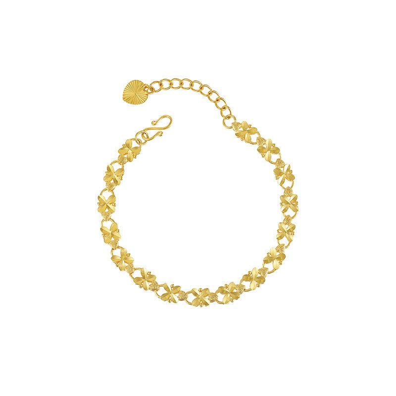 Edith – Goldenes Armband mit Gänseblümchen-Motiv